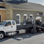 Ford work trucks towing a vehicle