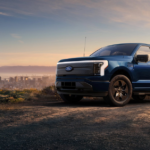 A Ford EV truck parked atop a hill