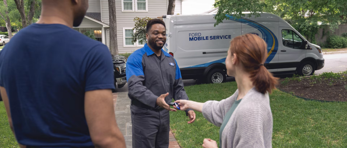 Ford Mobile Service technician picking up a vehicle