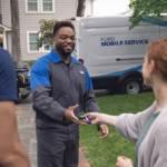 Ford Mobile Service technician picking up a vehicle