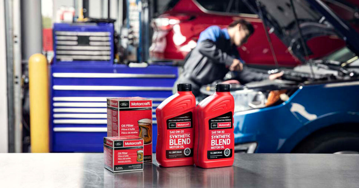Mechanic performing a Ford oil change