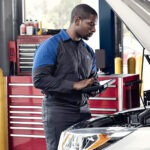 Ford service technician working under the hood